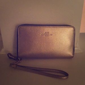Gold coach wristlet
